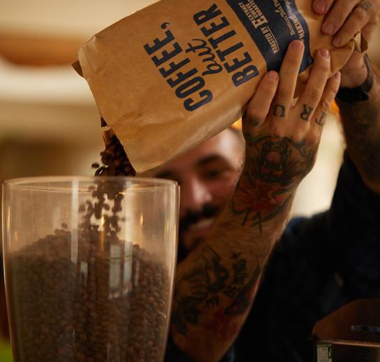 Ethically sourced coffee from Extract Coffee, made by our expert baristas. The bag has the words 'Coffee But Better' in blue written upon it
